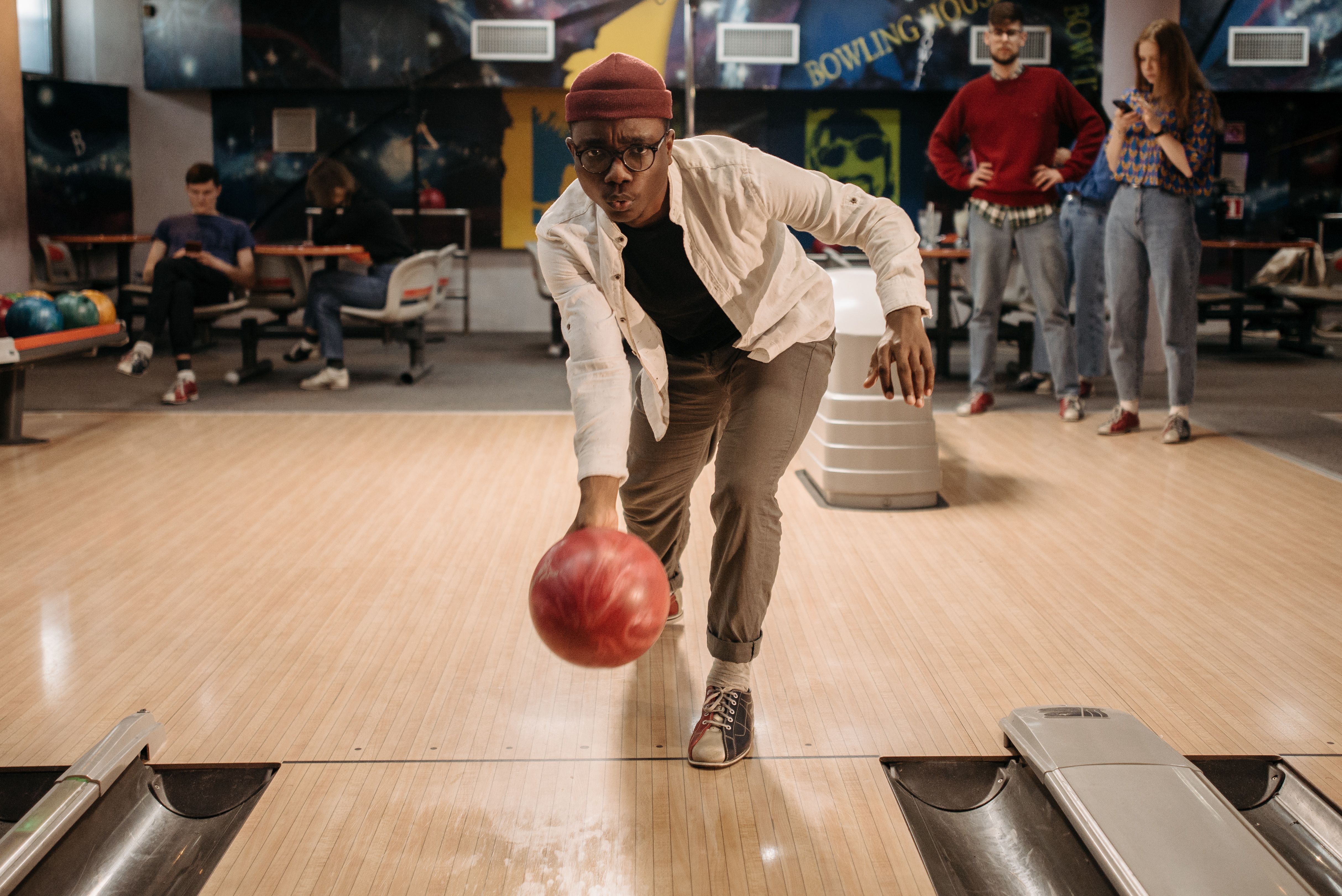 Friends bowling together