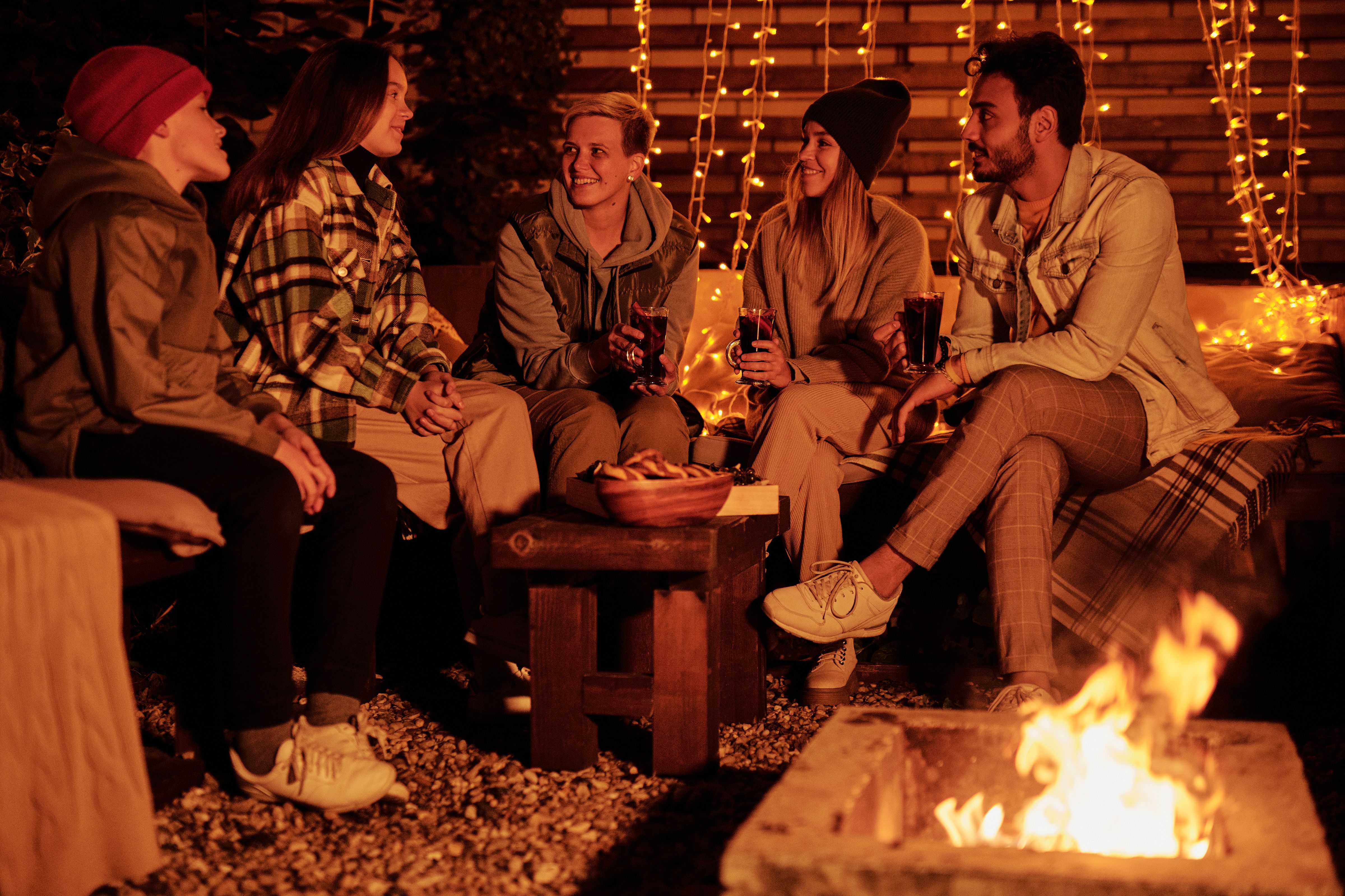 Group gathered around a nighttime bonfire