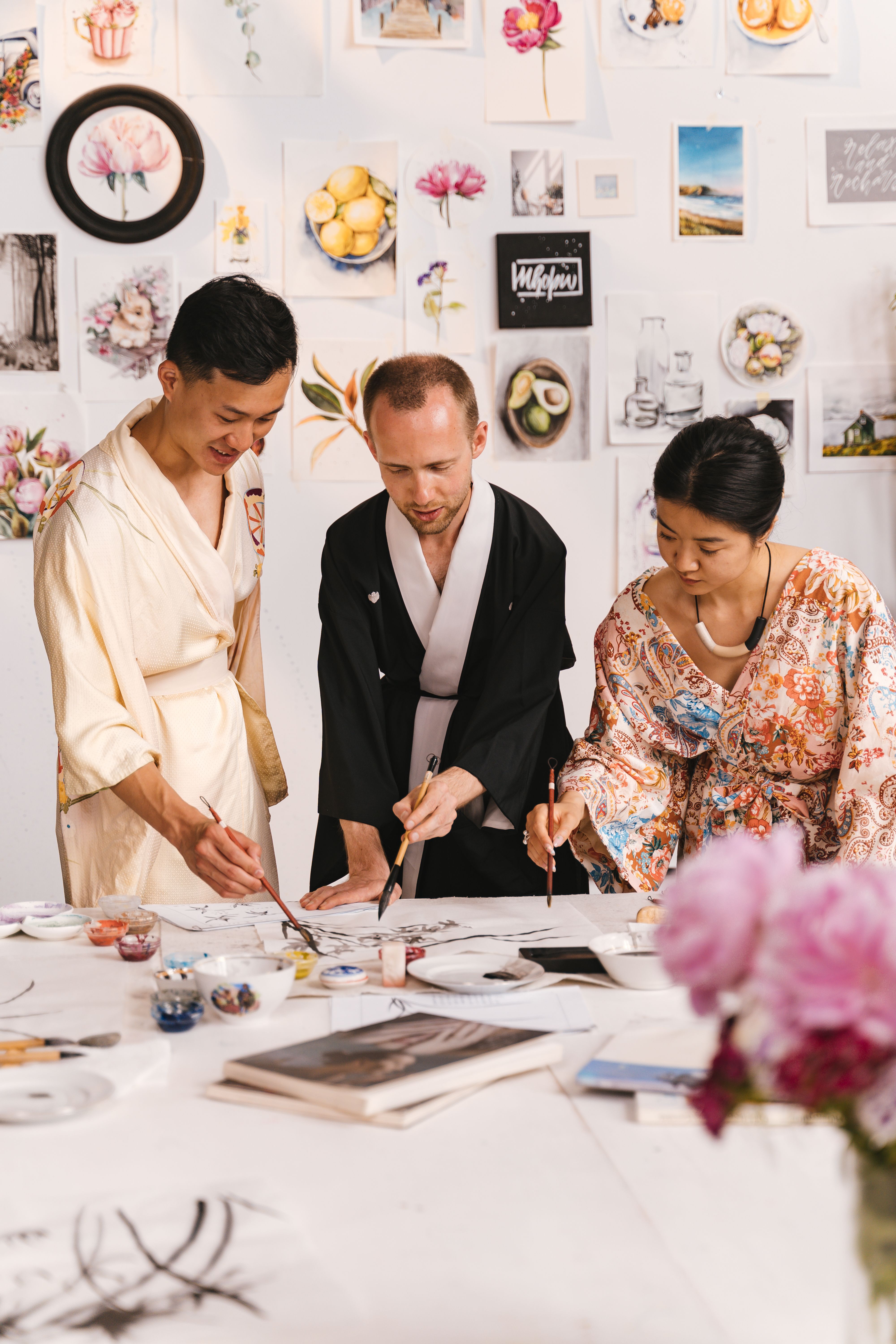 Friends painting together at a creative social event